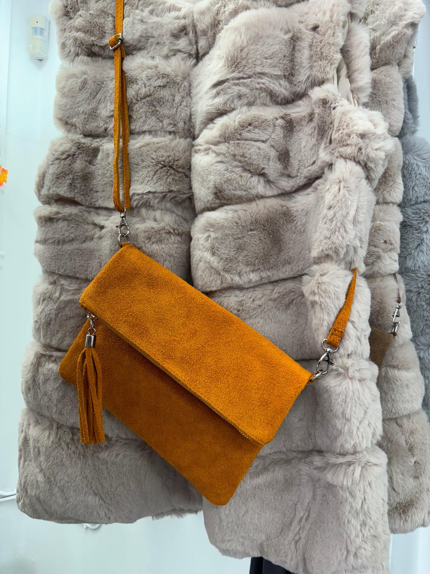 Orange suede clutch bag